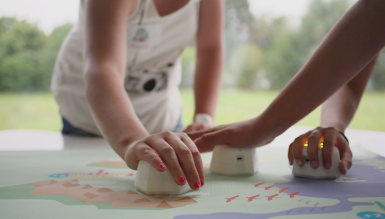 Kids interact with the Cellulo robot