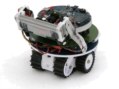 The marXbot robot is modular: here a configuration with gripper for building experiments.