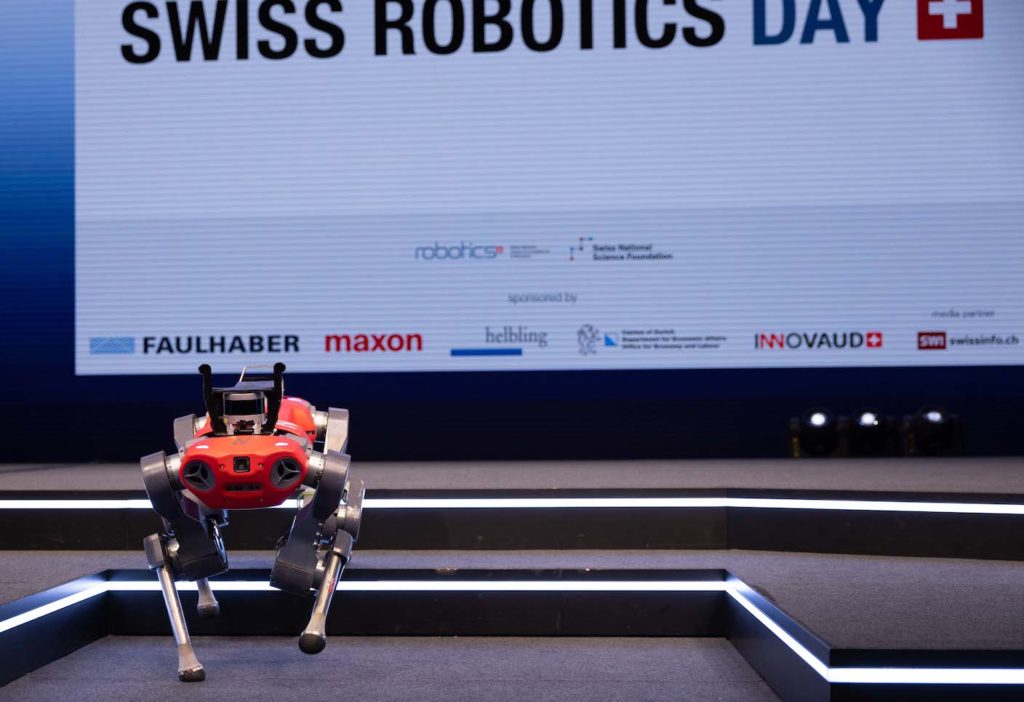 The ANYmal robot walking off the stage at the Swiss Robotics Day 2021