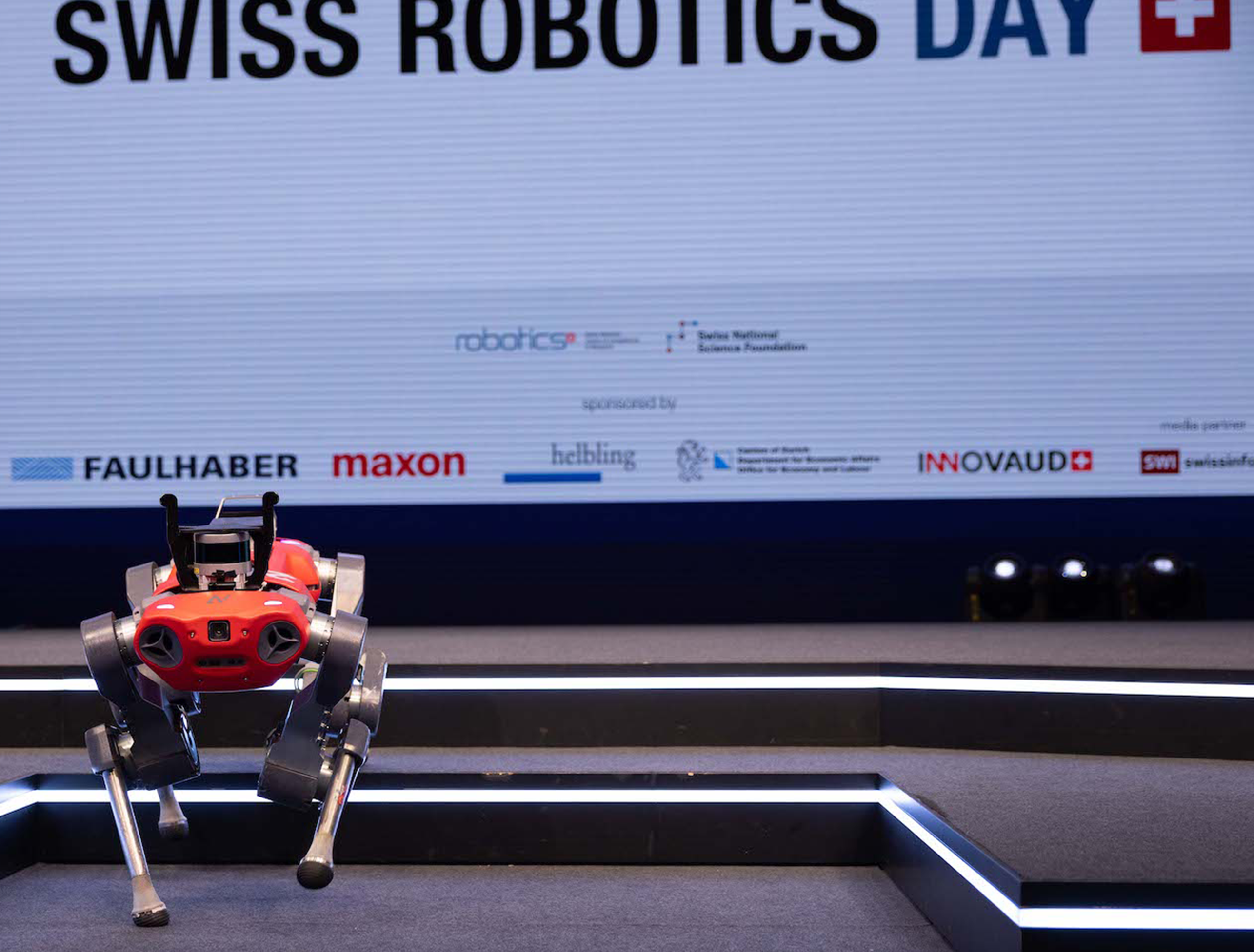 The ANYmal robot walking off the stage at the Swiss Robotics Day 2021