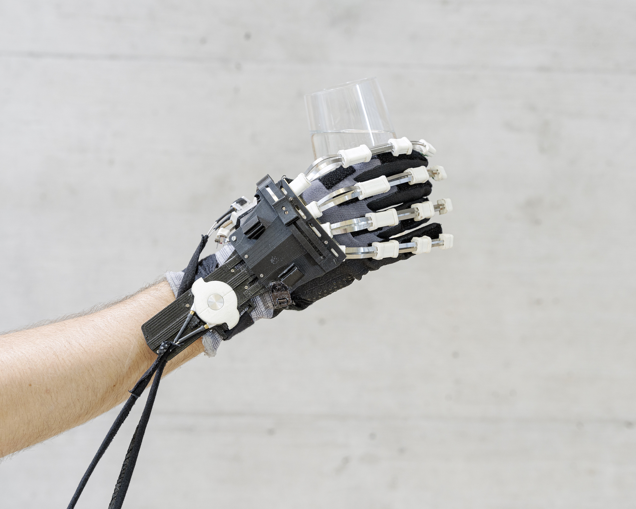 A highly compact and lightweight hand exoskeleton. Stroke, spinal cord injury and muscular atrophy are just few examples of diseases leading to persistent hand impairment. Wearable robotic devices can support the use of the impaired limb in activities of daily living, and provide at-home rehabilitation training. 

Rehabilitation Engineering Laboratory, ETH Zurich.